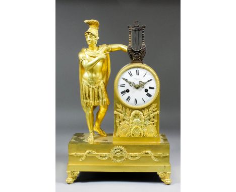 An early 19th Century French ormolu cased mantel clock, the 4ins diameter, white enamel dial with Roman numerals, inscribed B