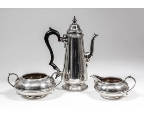 An Edward VII silver cylindrical coffee pot of tapered form and 18th Century design, the domed lid with turned finial, and wo
