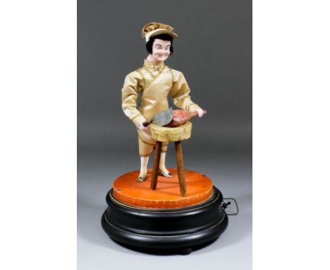 A late 19th / early 20th Century Continental automaton figure of a standing butcher with butcher's block and joint of meat, o