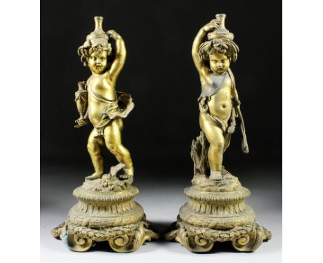 A pair of late 19th Century French gilt brass five light candelabra, modelled as standing Putti and emblematic of the seasons