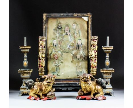 A Chinese black painted and gilt framed rectangular table screen inset with painting on silk depicting a seated bearded god w