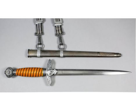 A German World War II Army dress dagger, the 9.5ins double edged bright steel blade etched "Original" over squirrel motif and