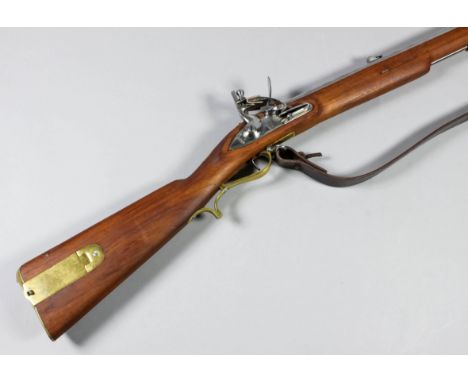 A reproduction "Brown Bess" short musket with 30ins bright steel barrel, the bright steel lock stamped crown over G.R. and "T