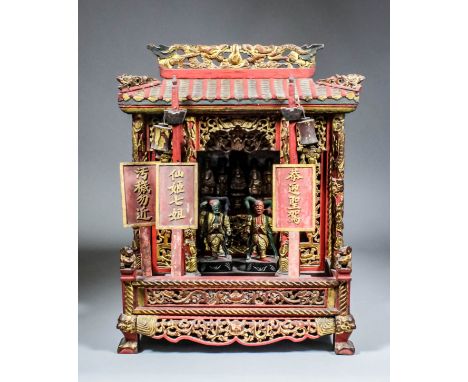 A Chinese carved and painted giltwood model of a home altar, the pagoda top with pierced and carved ridge with two dragons, o