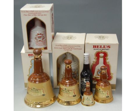 Assorted Bell's Scotch Whisky in Wade commemorative decanters, being 2x 75cl and 2x 50cl (all in cartons), one small 6 2 /3fl