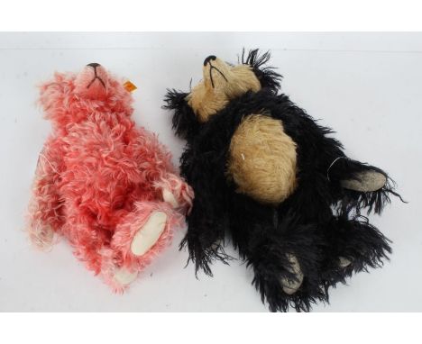 Steiff bear, with pink fur, 28cm long, together with a Ruben black and white bear with large snout and adjustable arms and le