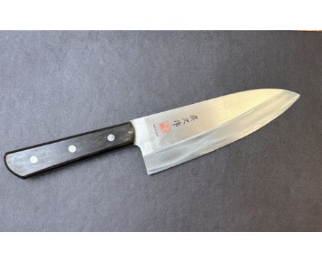 Japanese chefs knife signed Masahisa.Stainless hand forged Japanese chefs knife.Micron nicks to cutting edge needs a light st