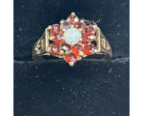 9ct Gold ring set with garnets cluster & central opal Size K.5 