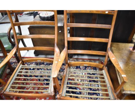 A pair of vintage teak chair frames by Parker Knoll, very stylised