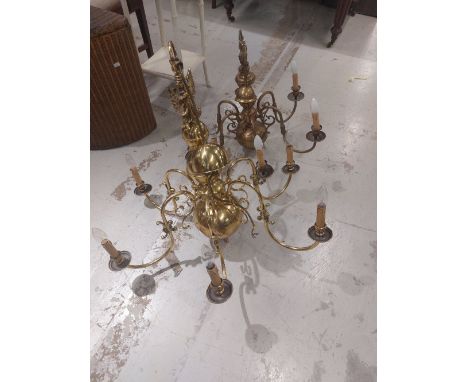 Two large brass Dutch style chandelier type light fittings, with double eagle head surmounts and faux candle sockets.