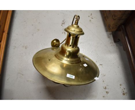 A vintage style brass ceiling light fitting
