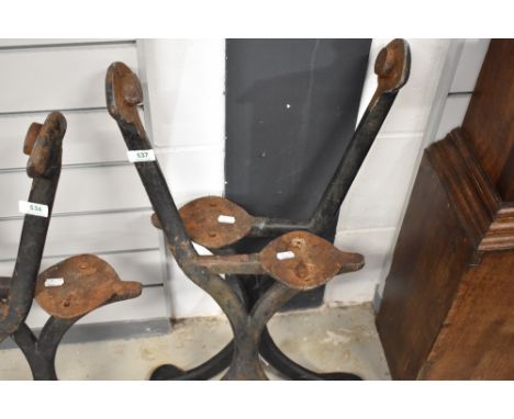 A pair of Victorian cast iron bench ends