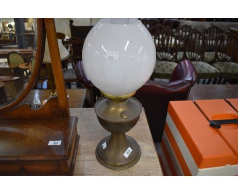 A vintage brass oil lamp