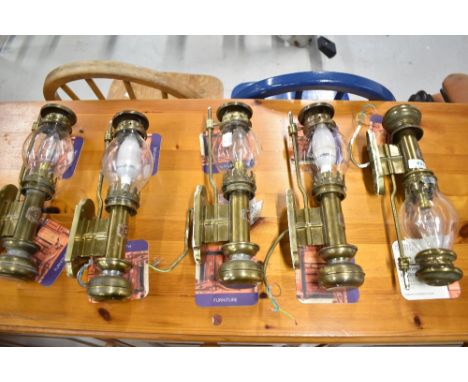 A set of five carriage style brass wall light fittings with glass shades (one af)
