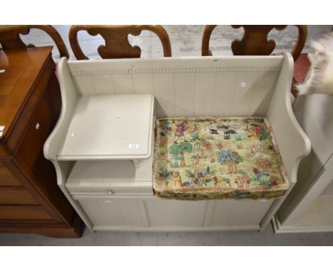 A vintage telephone table with under storage and drawer having been painted