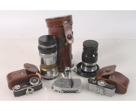 Ernest Leitz of Wetzlar Germany, a Elmar 1:4 f=9cm #165458 lens, a Trinol Anastigmat f/3.5 105mm #034464 lens, the collars st