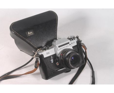 Leica Leicaflex SL2 camera body, serial number 1389072, fitted with Leitz Wetzlar lens #13358 P, held in Leitz black leather 