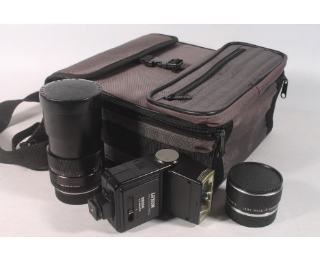 Leitz Canada Elmarit-R 1:2.8/135 #3028362 lens, a Leitz Extender-R 2x #3196340 for Leica Leicaflex SL/SL2 cameras, and a Luxo