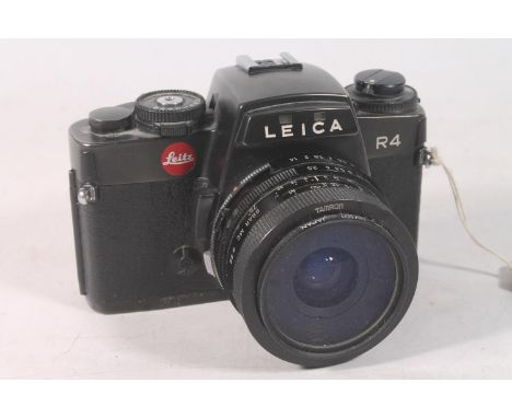 Leica R4 camera, serial number 1583606, the base stamped 'Made by Leitz Portugal', fitted with Tamron of Japan Hoya 49mm UV(O