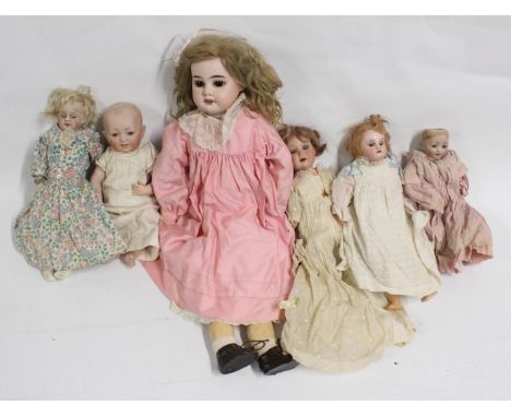 Armand Marseille of Kopplesdorf Germany, three bisque headed dolls 'AM 8 DEP' 55cm tall, 'G 327 B DRGM 259 A 4/O M' 27cm tall