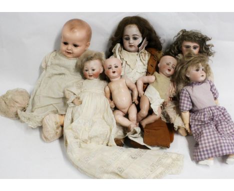 A B & Cie bisque headed dolls to include '3 1322 / 36' 34cm tall, two  '1352 32' 29cm, and '1323' 12cm tall, and others. (8) 