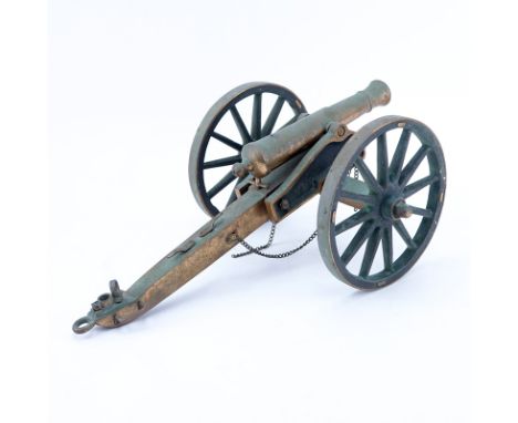 Antique Heavy Brass Model of a Army Canon. Unsigned. Greenish residue throughout the surface and rubbing gilt, one chain is l