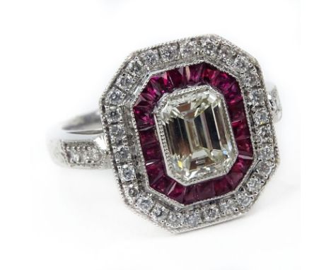 Approx. 1.65 Carat TW Diamond, .40 Carat Ruby and Platinum Ring set in the center with an Approx. 1.25 Carat Emerald Cut Diam