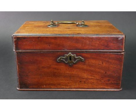 A George III mahogany tea caddy, rectangular with moulded edges and corners, the hinged cover with a brass carrying handle, l