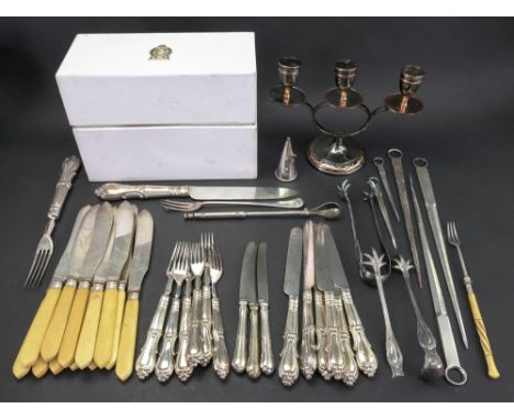 A three light candelabrum, on spreading circular foot, 21cm wide, in fitted case, labelled 'With Best Wishes from The Prime M