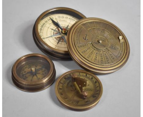A Collection of Two Reproduction Circular Brass Compasses One with Sundial Lid the Other with 100 Year Calendar Lid, Largest 