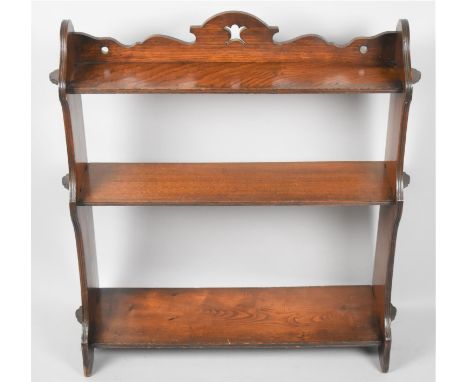 An Edwardian Mahogany Wall Hanging Three Shelf Unit with Pierced Top Gallery, 63cm Wide 