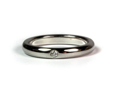 A platinum Tiffany & Co diamond set wedding band (K.5).