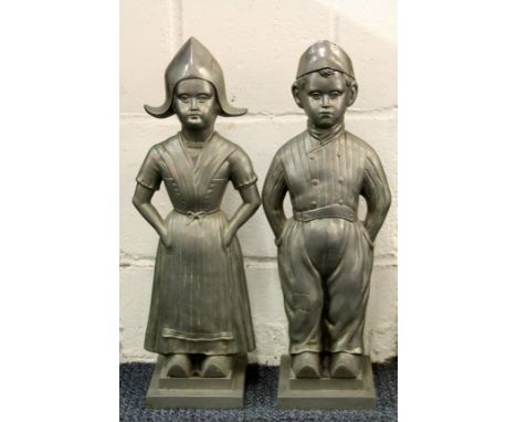 A pair of 1920's fireside companion set stands (without tools) of Dutch children, H. 52cm.