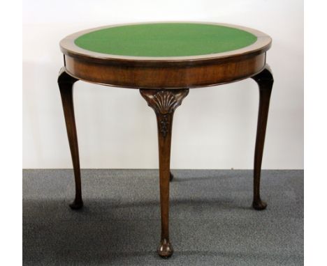 A 1920's burr veneered mahogany demi-lune folding card table, Dia. 80cm