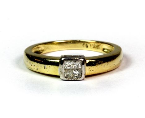 An 18ct yellow and white gold (stamped 18k) diamond set ring (K.5).