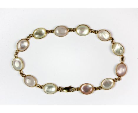 A 9ct yellow gold (stamped 9k) mother of pearl set bracelet.