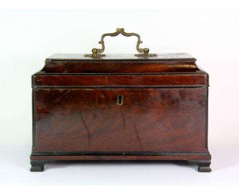 An unusual Georgian mahogany triple tea caddy fitted with mixer and spoon slots, 26cm x 14cm x 17cm.