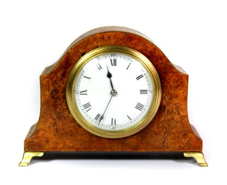 A small burr walnut veneered mantle clock raised on small brass bracket feet, H. 15cm.
