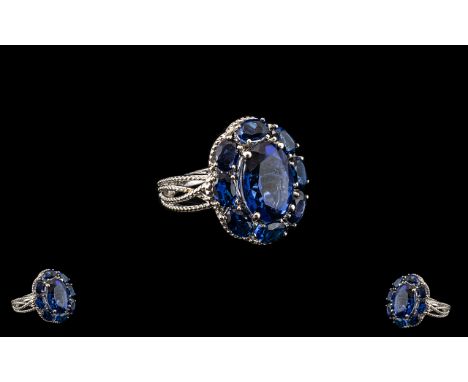 Ceylon Blue Coloured Quartz Cluster Ring, 10.25cts; a statement ring comprising a 6ct oval cut Ceylon blue coloured quartz, s