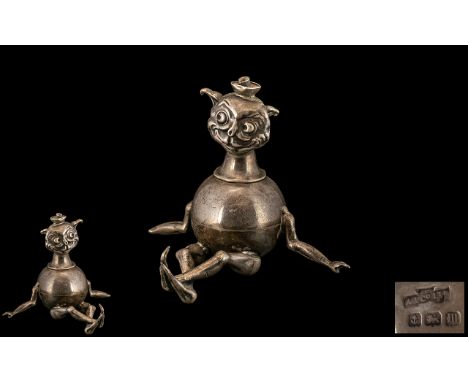 Novelty Silver Table Top Lighter, dated Birmingham 1911.  Rare comical sitting figure in the form of an imp.  Missing part of