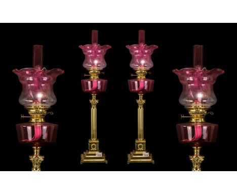 Pair of Reproduction Victorian Style Ruby Red Oil Lamps with Ruby Font and Matching Shade and Funnel, Supported on a Corinthi