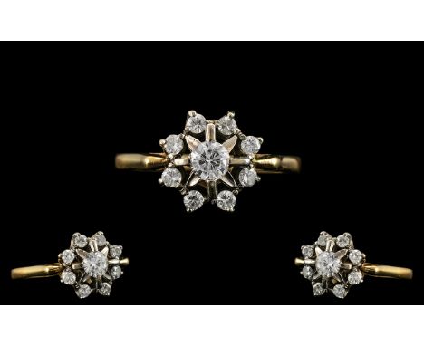 18ct Gold and Platinum Attractive Diamond Set Cluster Ring of Pleasing Design. The Larger Central Diamond Surrounded by 8 Dia