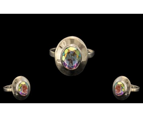 Mercury Mystic Topaz Solitaire Ring, a 3.25ct oval cut Mercury mystic topaz solitaire set in a streamlined silver mount; size