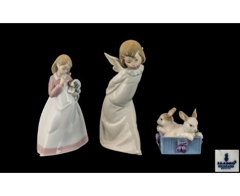 A Trio of Lladro and Nao Hand Painted Porcelain Figures ( 3 ) In Total. Tallest Figure 9.75 Inches. All Figures are 1st Quali