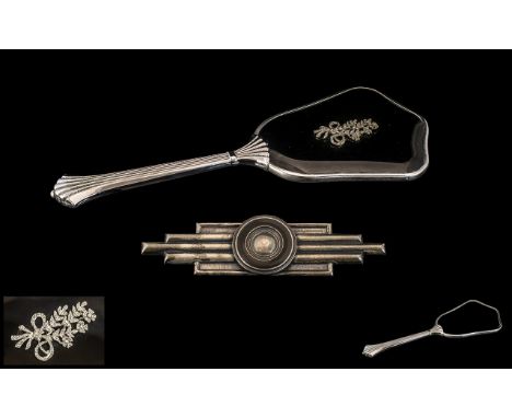 Art Deco Chrome Plated Black Enamel Hand Mirror, with a floral decoration applied. together with a silvered metal black ename