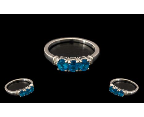 Neon Apatite and Diamond Ring, three oval cut neon apatites, the unique bright, deep turquoise variety of apatite, totalling 