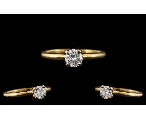 A Single Stone Diamond Ring, round modern brilliant cut diamond.  Four claw setting, yellow gold.  Estimated diamond weight .