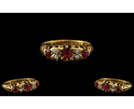 Edwardian Period 18ct Gold Attractive Ruby and Diamond Set Ring - Gallery Setting. The Three Faceted Rubies with 4 Diamond Sp