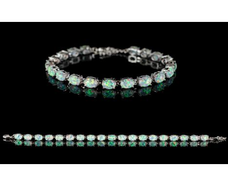 White And Opal Style Set Tennis Bracelet - Comprising 19 Opal Style Stones. Of Iridescent Lustre, Set Between Articulated Sil