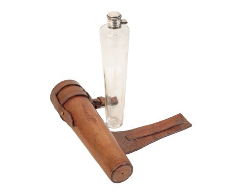 AN EDWARDIAN GENTLEMAN'S SILVER TOP AND GLASS HUNTING SPIRIT FLASK in the original leather saddle case